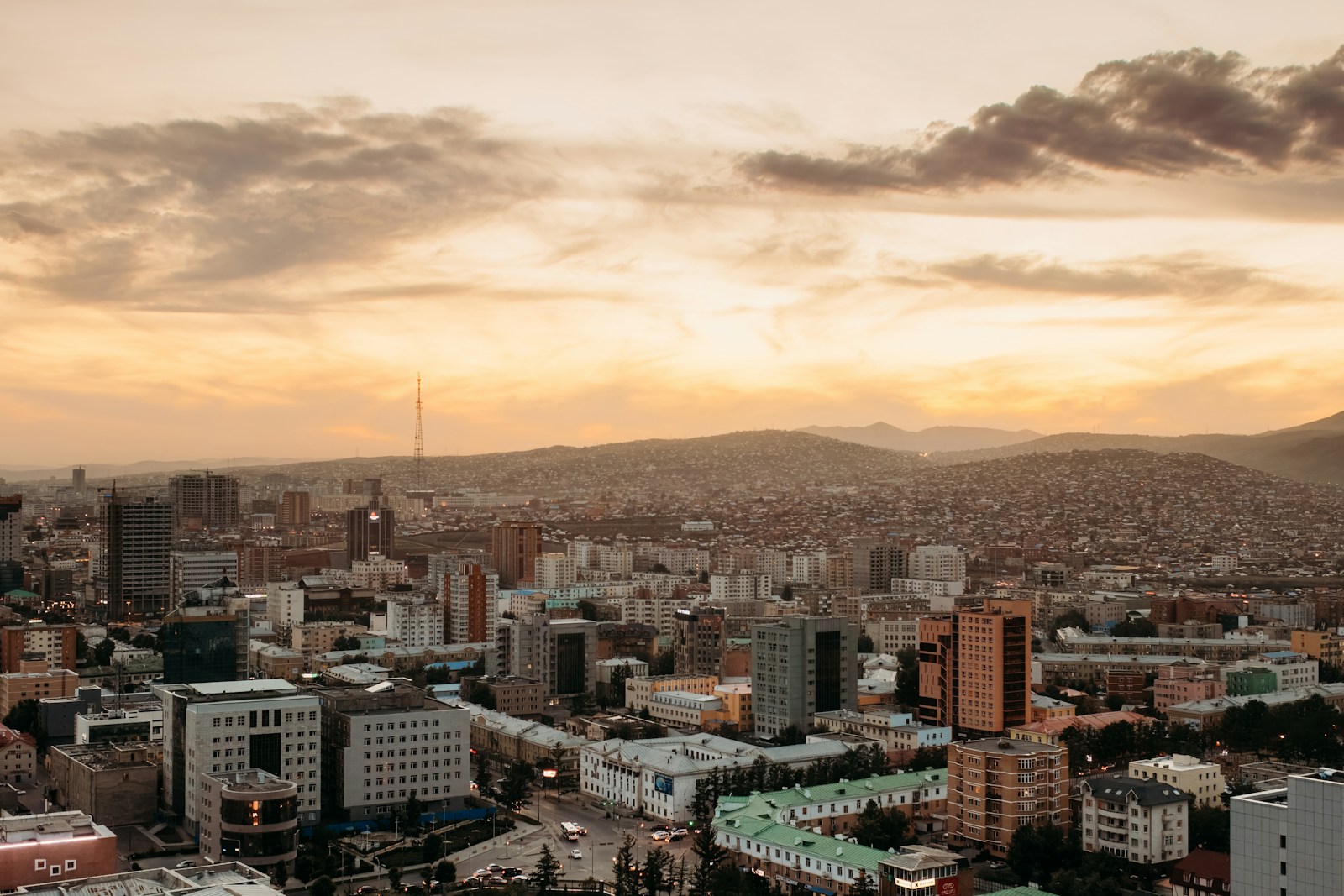 a view of a city with mountains in the background