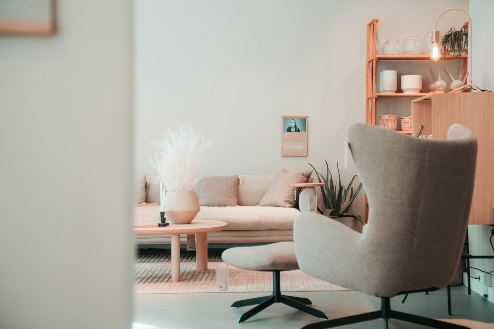 a living room with a couch, chair and a table