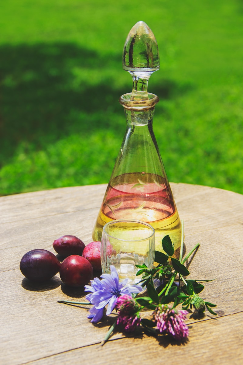 a bottle of oil sitting on top of a wooden table