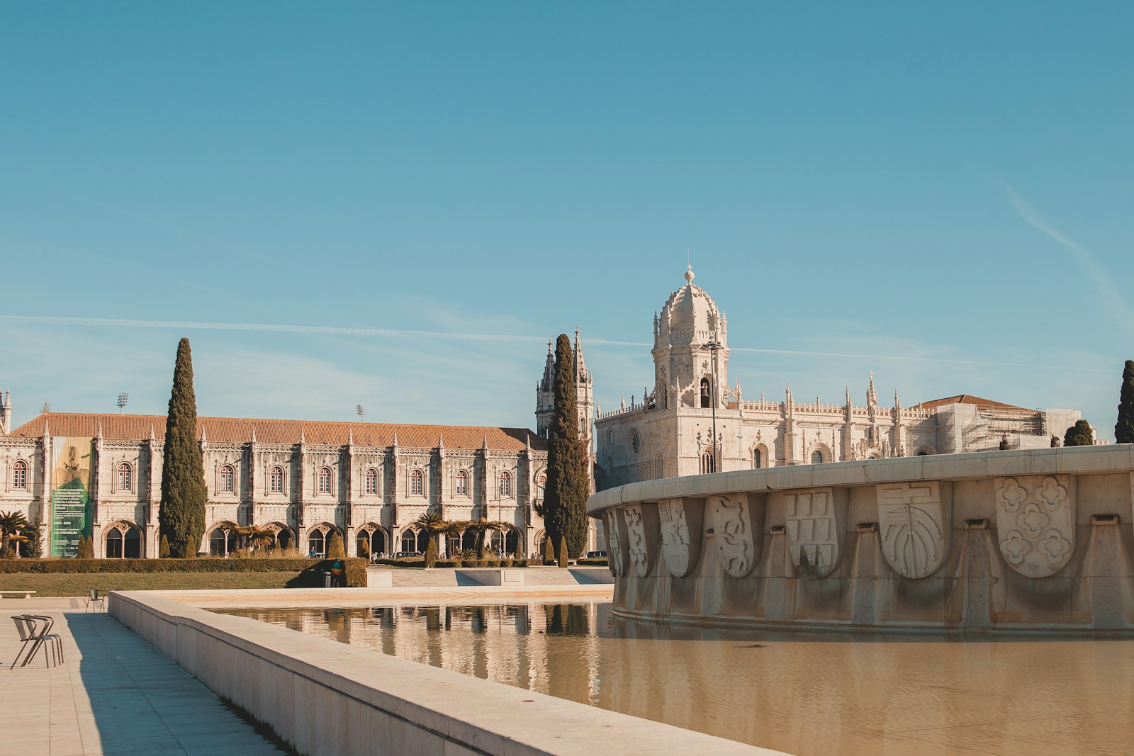 a large building with a fountain in front of it